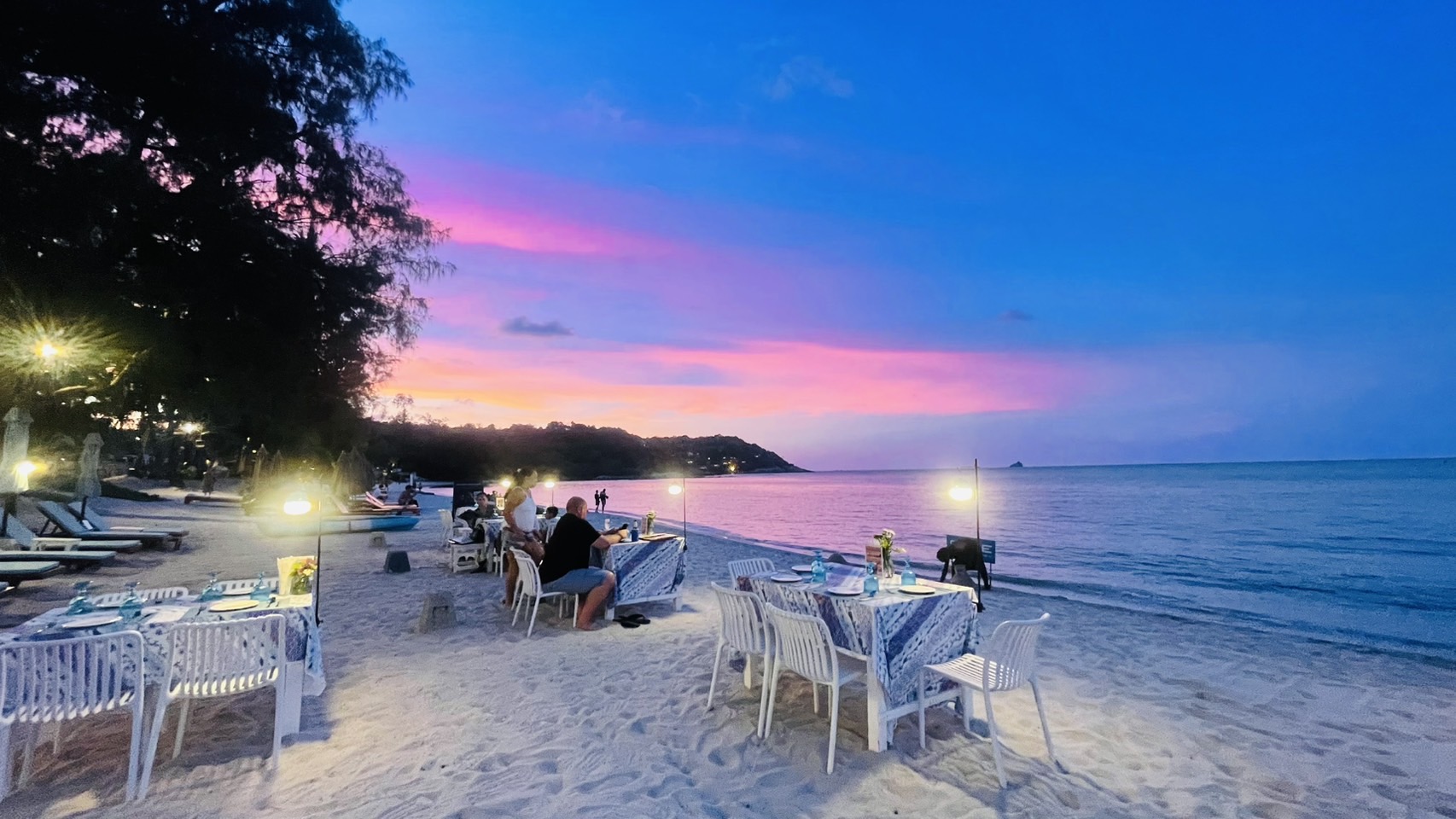 Beachfront evening dining at The Blue Spice — twilight over Choeng Mon Beach, Koh Samui