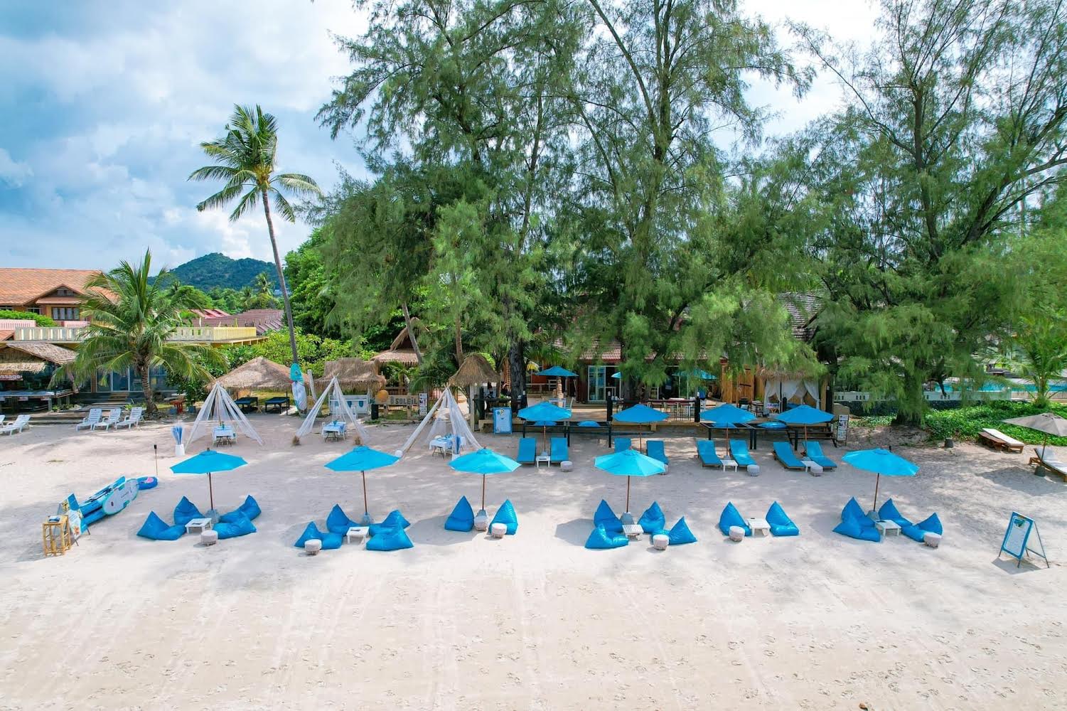 The Blue Spice beach setup — sunbeds, beanbags and umbrellas on Choeng Mon Beach, Koh Samui